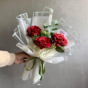 3 Red Roses transparent plastic wrapped bouquet