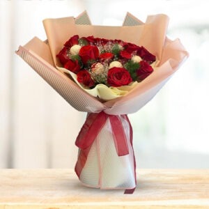 15 premium roses wrapped with premium light pink wrapper tied up with red ribbon
