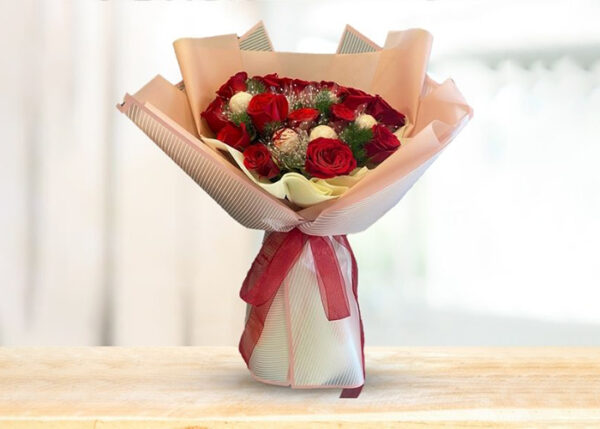 15 premium roses wrapped with premium light pink wrapper tied up with red ribbon